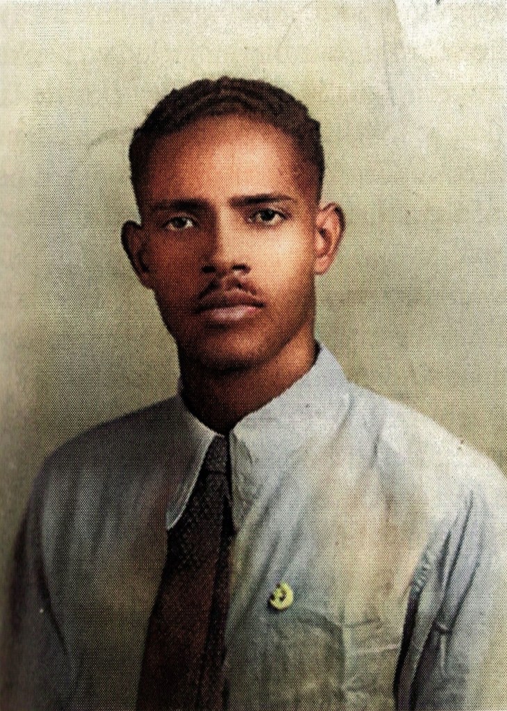 Portrait of Abdirizak Haji Hussein at 22 wearing a pin of the Crescent and Kuluub (Club) the symbol attached to the Somali Youth movements in 1947